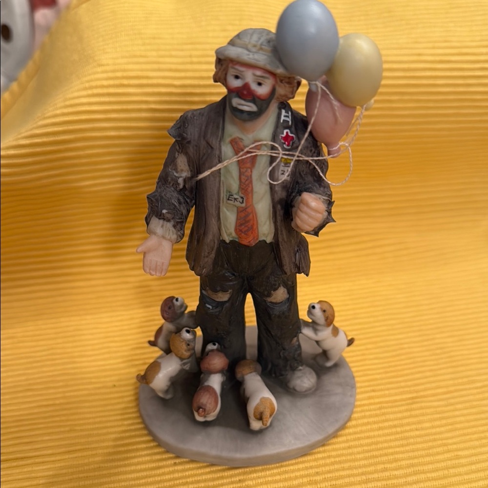 Hobo clown with puppies